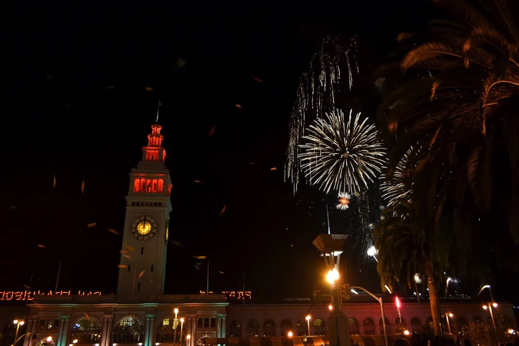 New Year fireworks over the Embarcadero beside the Ferry Building clock tower